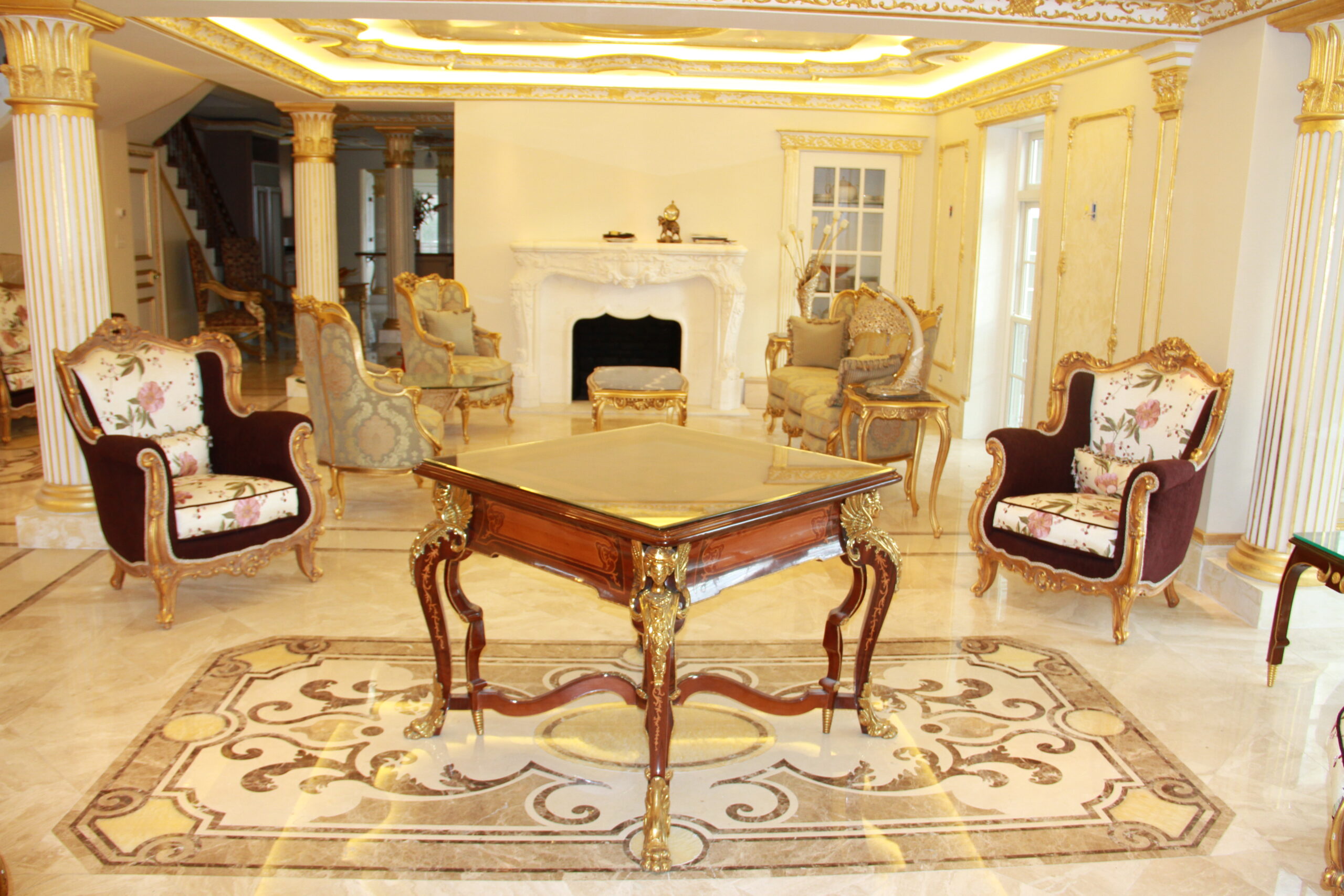 Botticino Marble Floor with Golden Medallion & Hand-Carved Marble Mantles in Grand Room